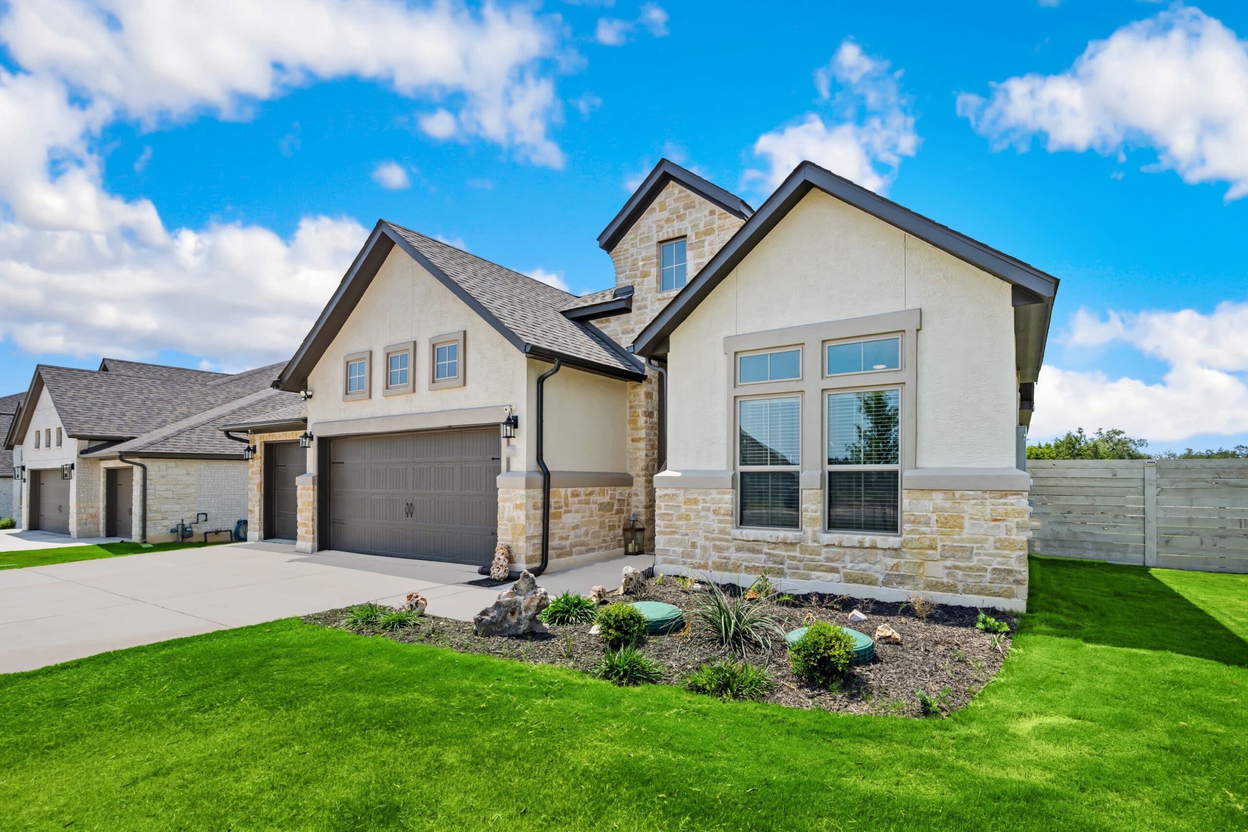 a family home with a green lawn